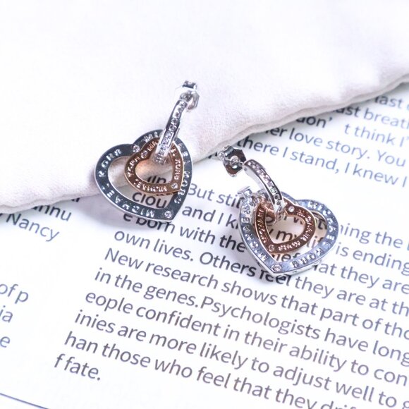Michael Kors Interlocking Silver Rose Gold Heart Earrings - Picture 2 of 2